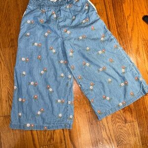 Mini Boden wide-leg trousers with an embroidered floral pattern